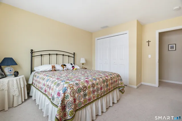 a livingroom with workspace and a couch