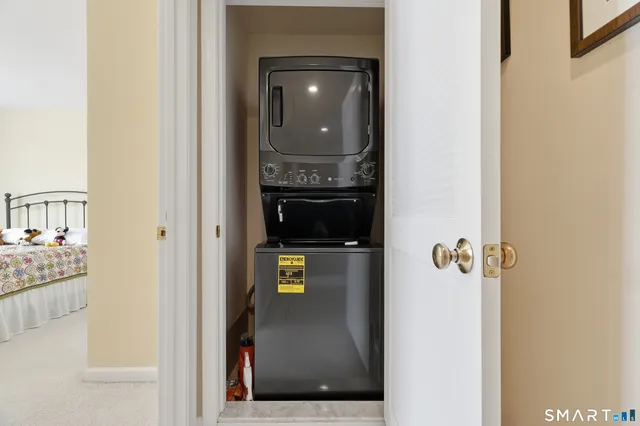 a view of a chair and table in the balcony