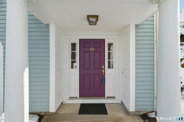 a view of front door with red door