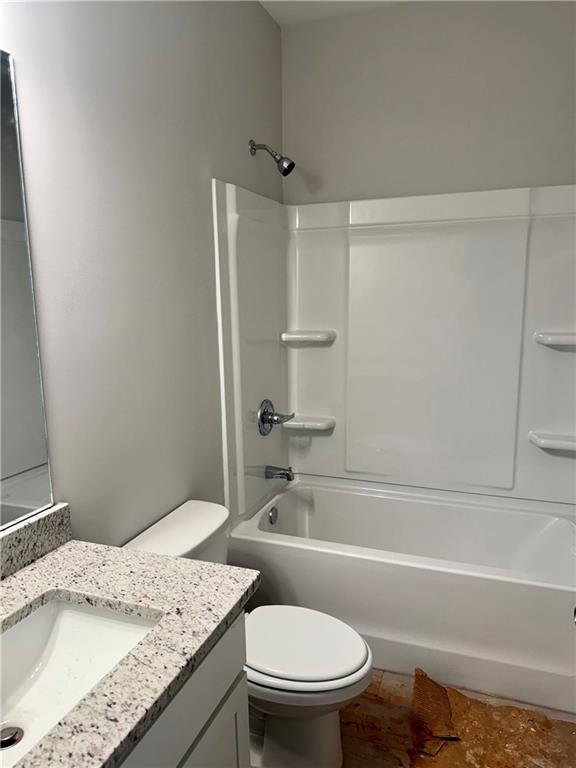 503 Charleston Place Villa Rica, GA 30180 - Photo 5 of 14 a bathroom with a granite countertop sink toilet and shower
