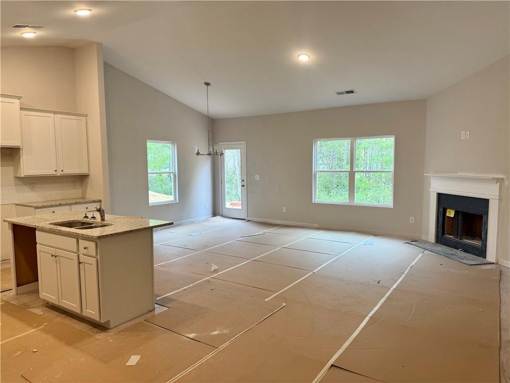 503 Charleston Place Villa Rica, GA 30180 - Photo 7 of 14 a kitchen with a stove a sink and a window