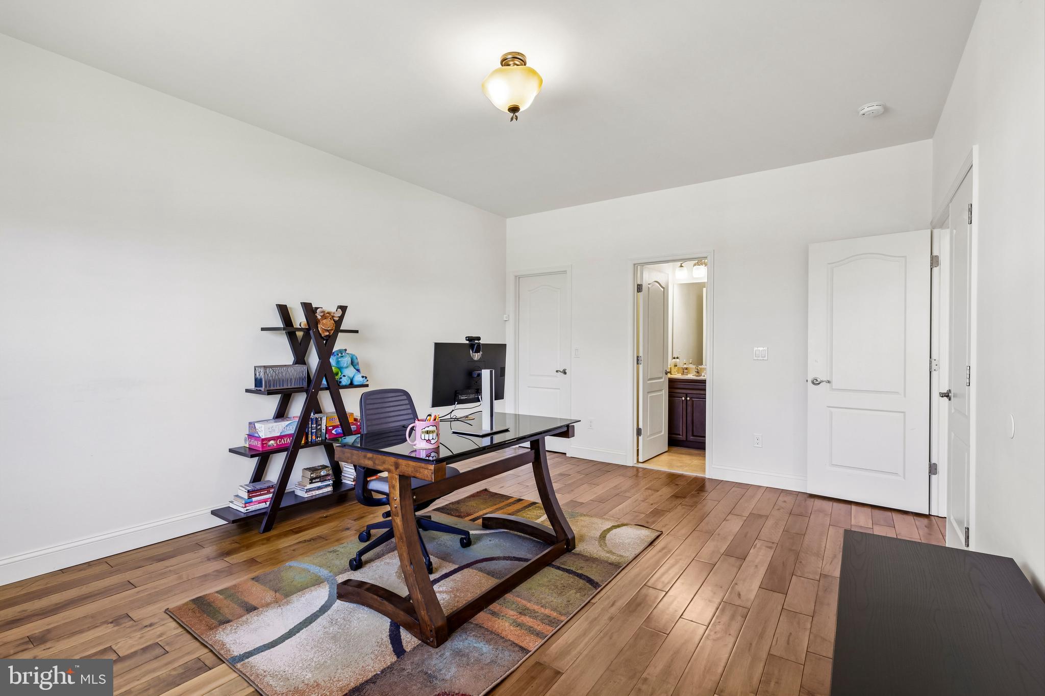 41 Emerald Road Robbinsville, NJ 08691 - Photo 22 of 69 a view of a workspace with furniture and wooden floor