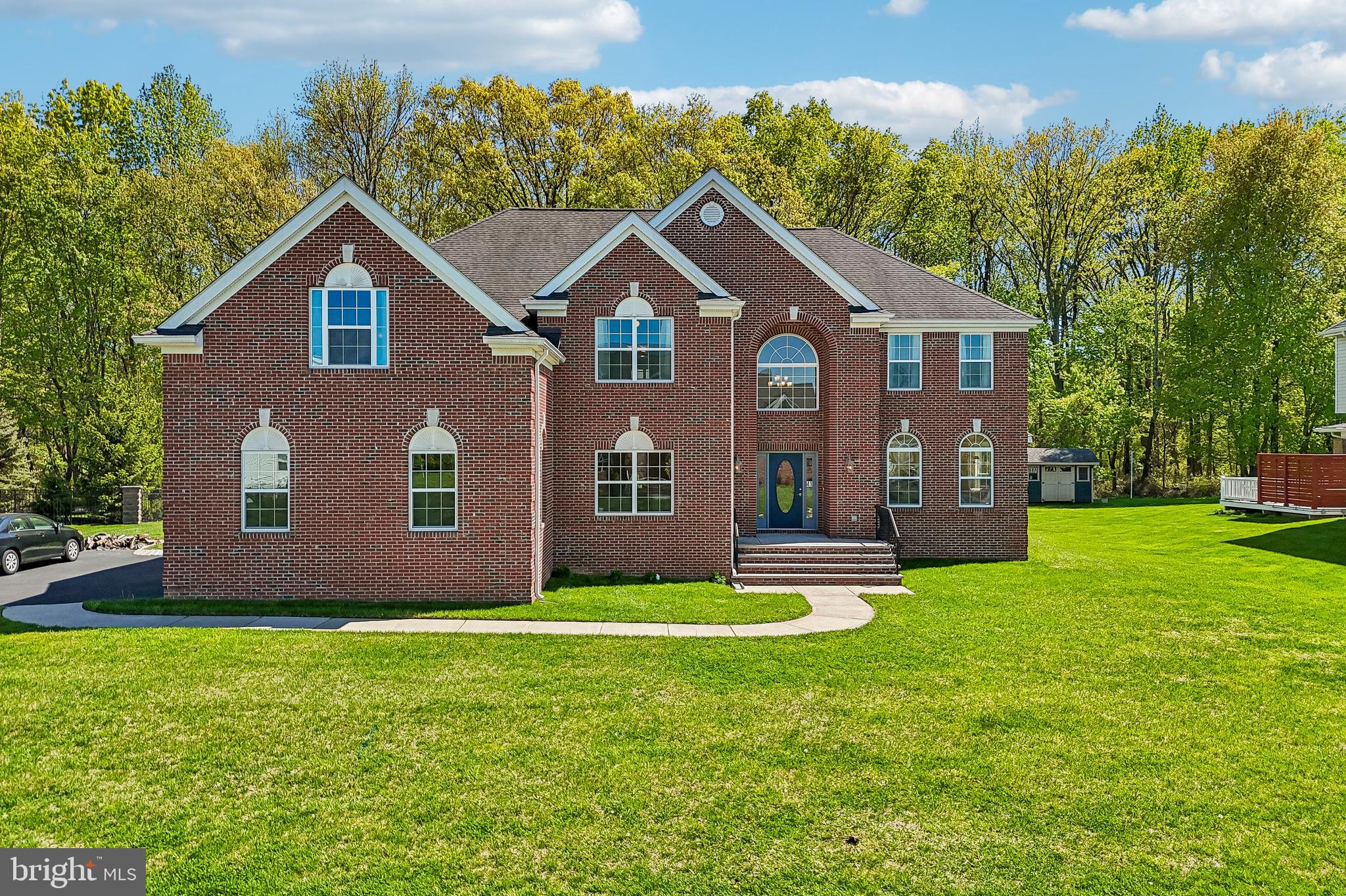41 Emerald Road Robbinsville, NJ 08691 - Photo 3 of 69 a front view of a house with a yard and garage