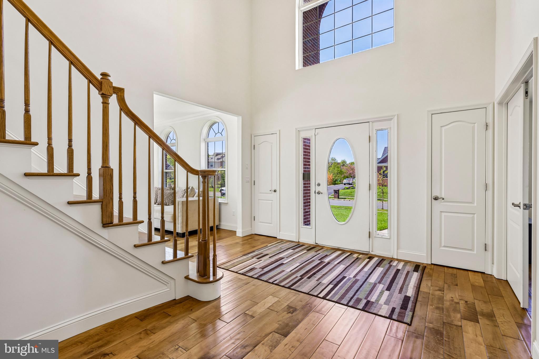 41 Emerald Road Robbinsville, NJ 08691 - Photo 5 of 69 a view of an entryway with wooden floor and stairs