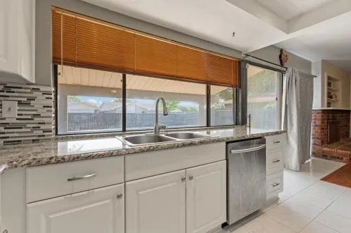 a kitchen with granite countertop cabinets and a sink