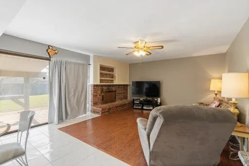 a view of a livingroom with furniture and a flat screen tv