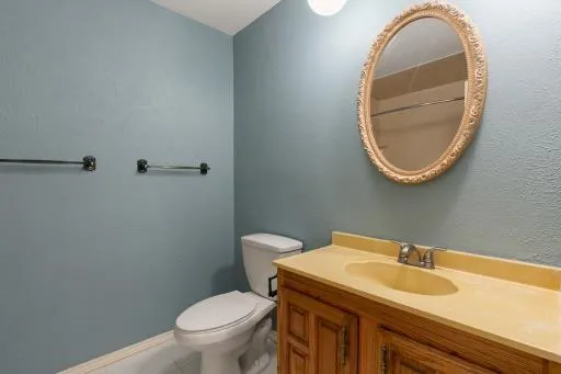 a bathroom with a toilet and a sink
