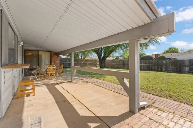 a view of swimming pool with a patio