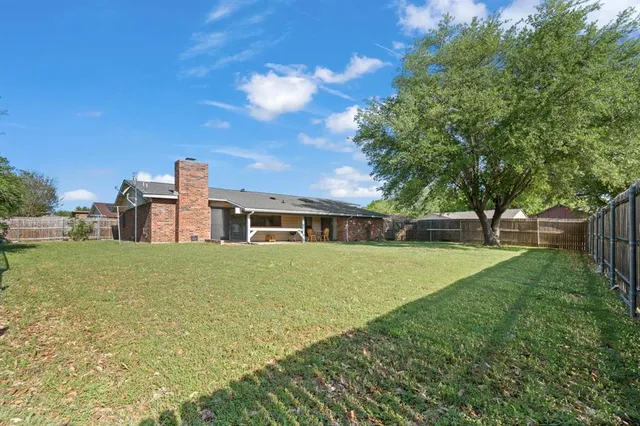 a backyard of a house with lots of green space