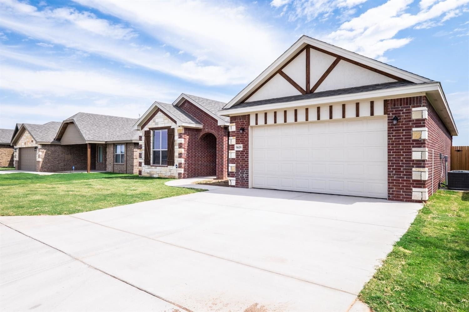 9609 Hyden Avenue Lubbock, TX 79424 - Photo 3 of 29 a front view of a house with a yard and garage