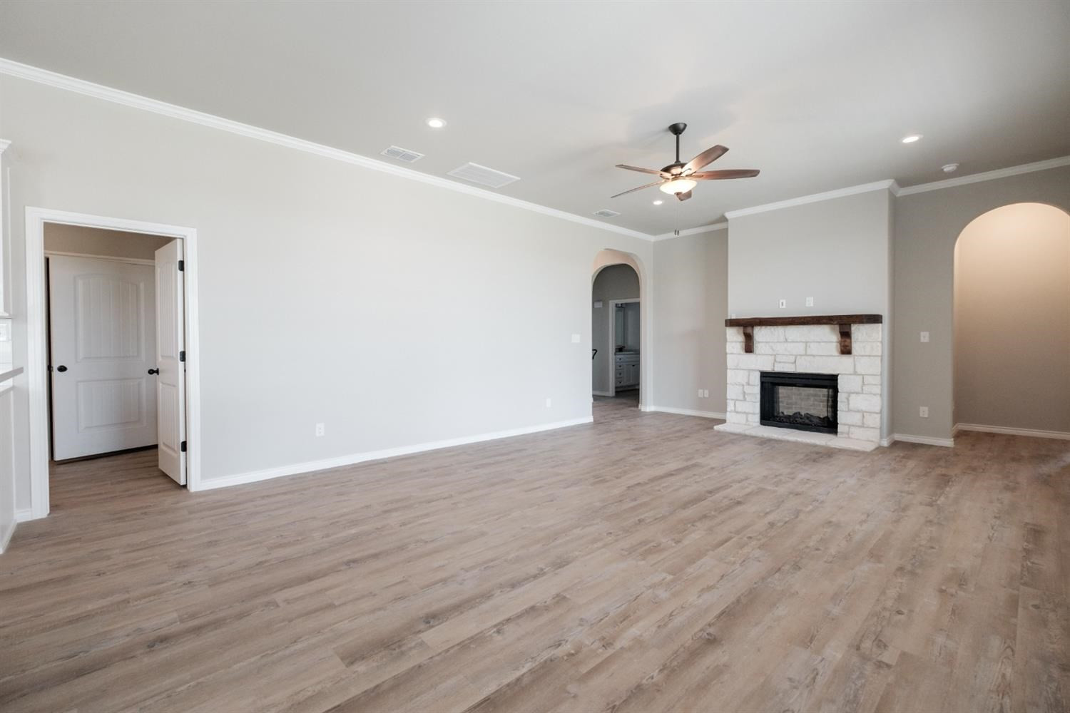 9609 Hyden Avenue Lubbock, TX 79424 - Photo 8 of 29 an empty room with closet and a fireplace