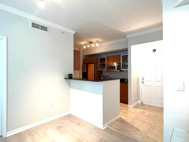 a view of kitchen with cabinets