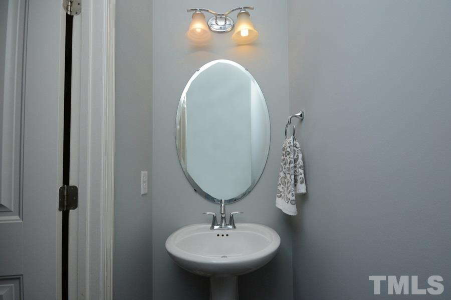 1003 Lakeview Road Durham, NC 27712 - Photo 24 of 25 a bathroom with a sink and a mirror