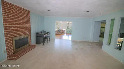 a view of a livingroom with furniture and fireplace
