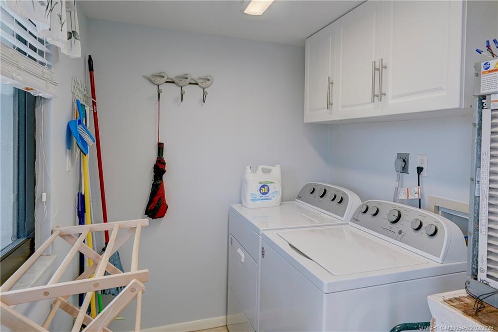 40 Northeast Plantation Road, Unit 309 Jensen Beach, FL 34957 - Photo 11 of 44 a utility room with dryer and washer