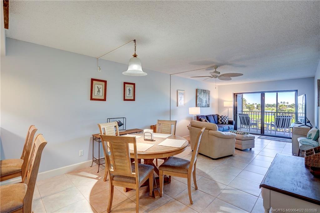 40 Northeast Plantation Road, Unit 309 Jensen Beach, FL 34957 - Photo 16 of 44 a view of a dining room with furniture
