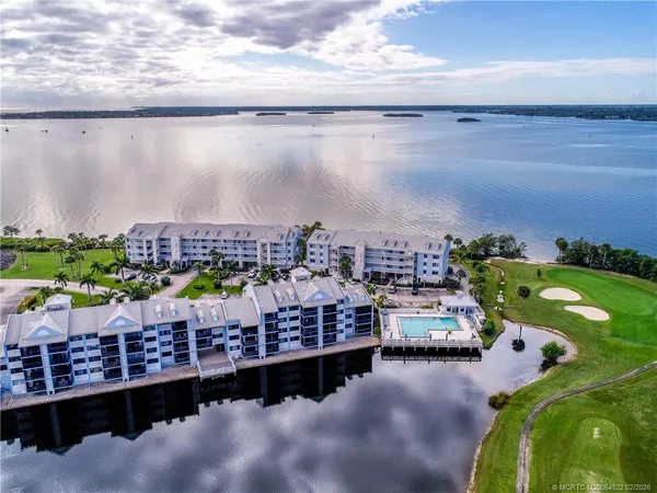 a view of a lake with an outdoor seating