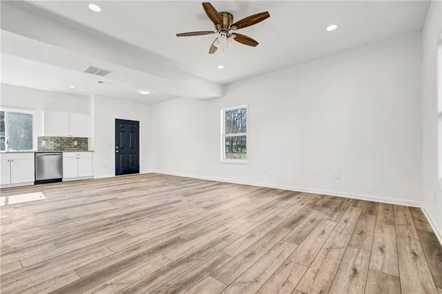 a view of a kitchen with a dishwasher and a window