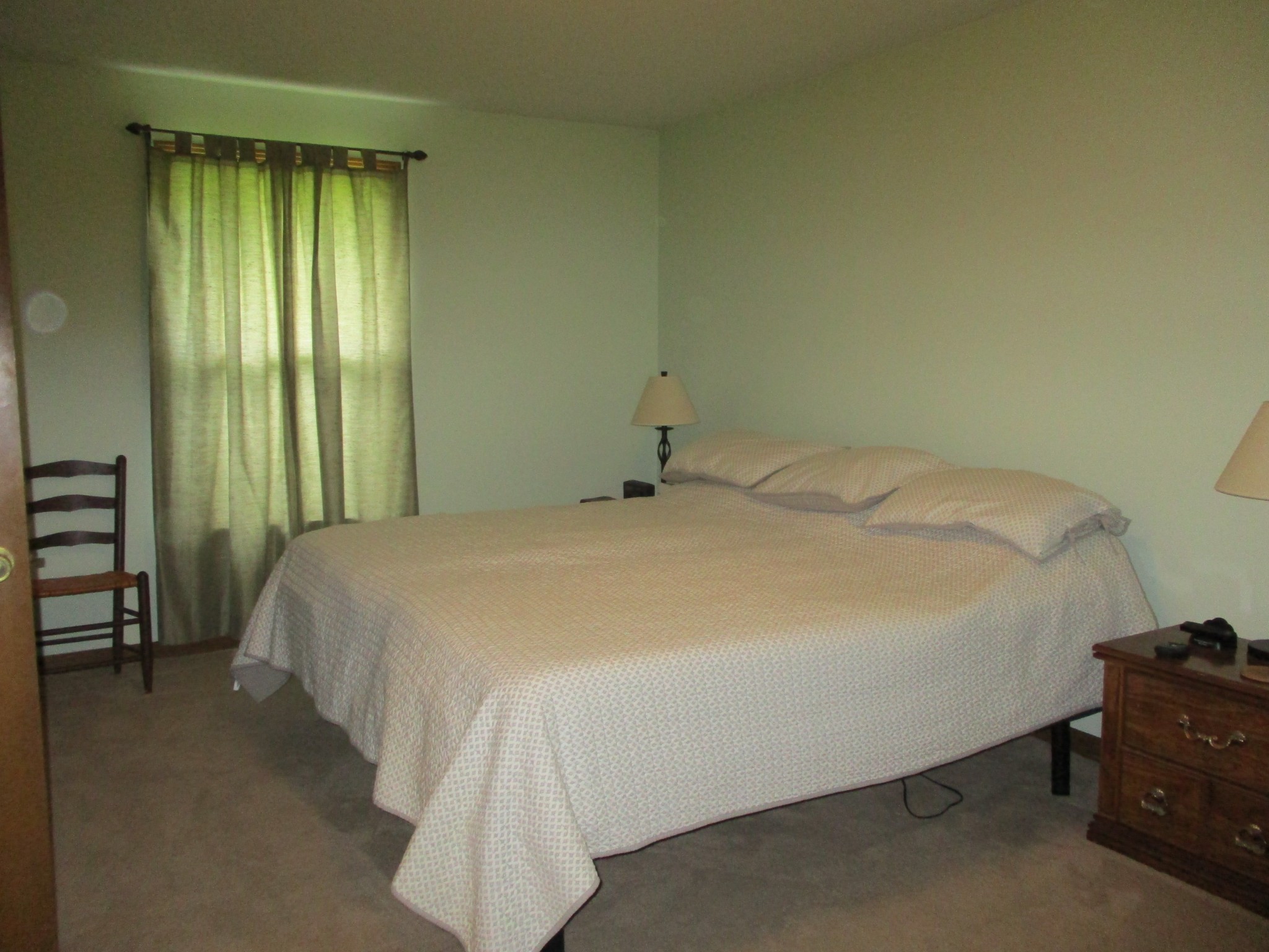 6206 Hickory Ridge Road Lebanon, TN 37090 - Photo 25 of 28 a large bed sitting in a bedroom next to a window