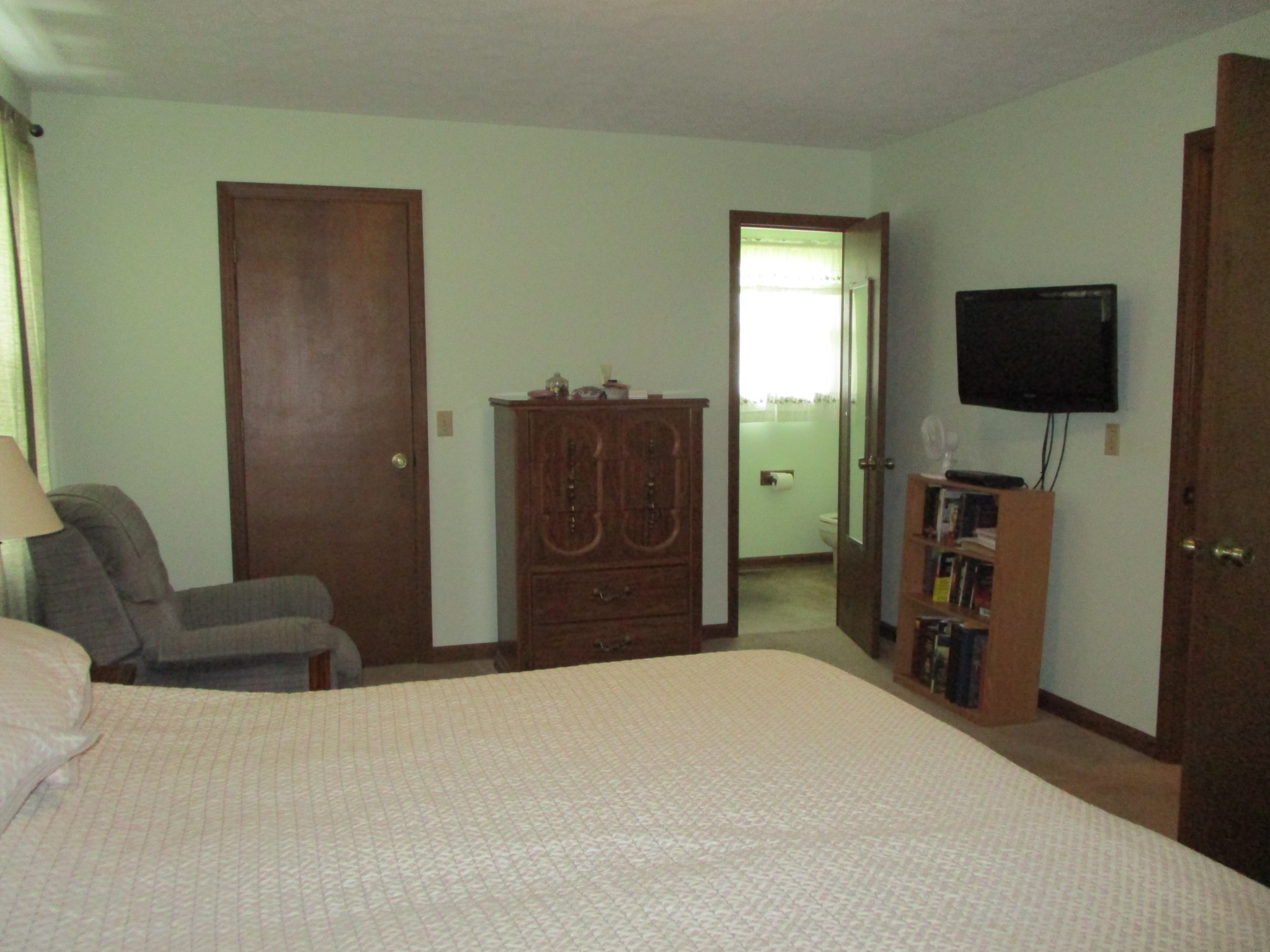 6206 Hickory Ridge Road Lebanon, TN 37090 - Photo 26 of 28 a bedroom with a bed and a flat screen tv