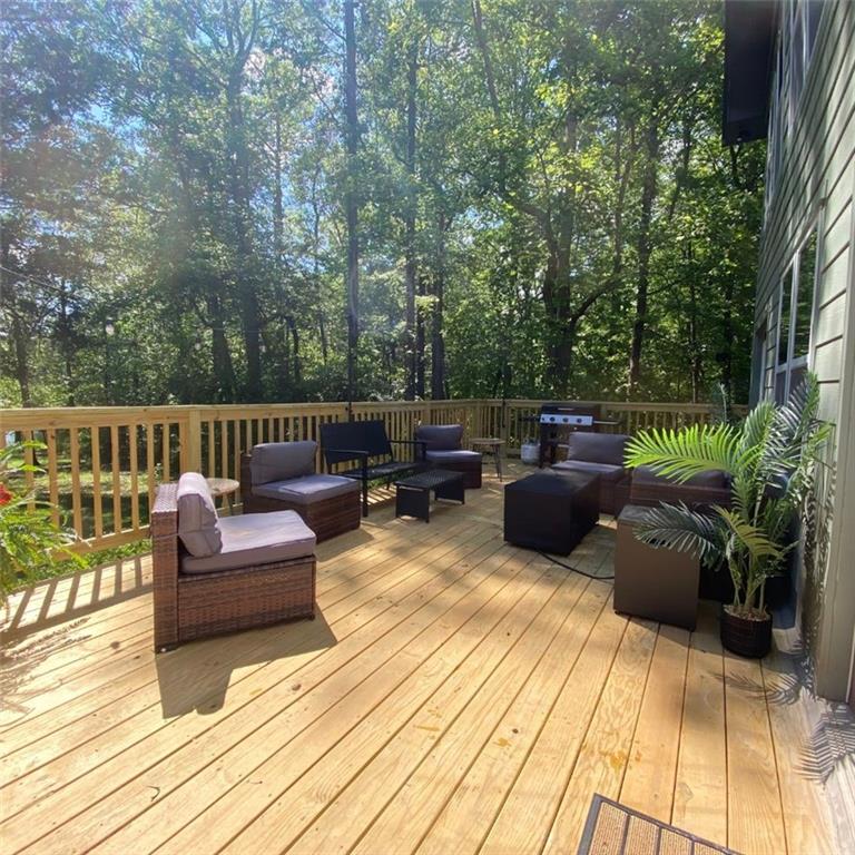 330 Ivy Trail Hartwell, GA 30643 - Photo 31 of 34 a view of a roof deck with couches and potted plants