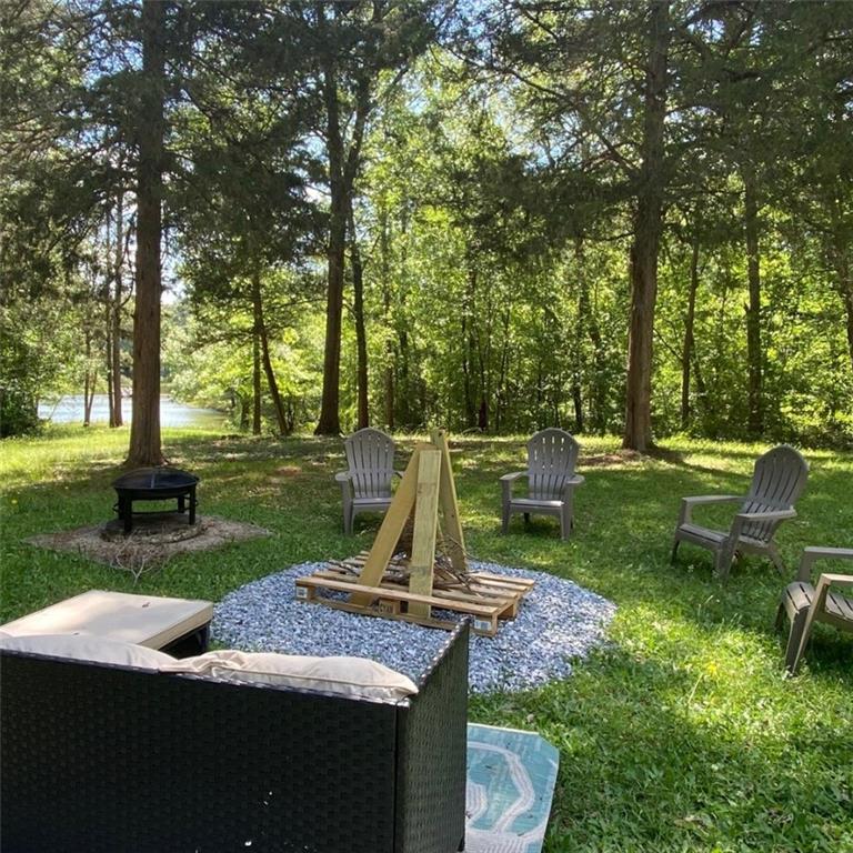 330 Ivy Trail Hartwell, GA 30643 - Photo 32 of 34 a view of a park with large trees and a slide