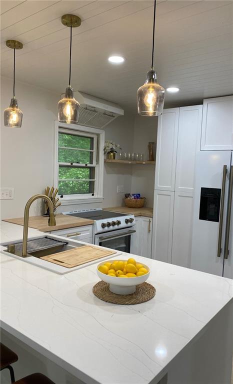 330 Ivy Trail Hartwell, GA 30643 - Photo 7 of 34 a view of a kitchen with a sink and a chandelier