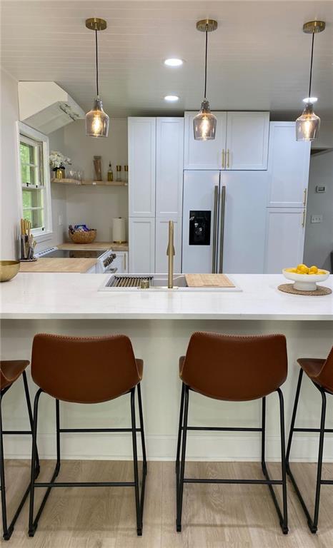 330 Ivy Trail Hartwell, GA 30643 - Photo 10 of 34 a kitchen with stainless steel appliances granite countertop a dining table chairs and a refrigerator