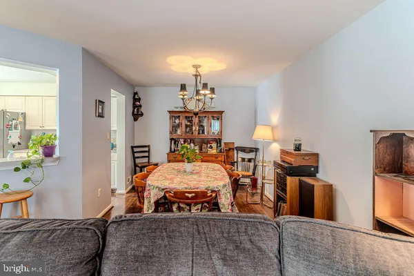 a bedroom with furniture and a chandelier