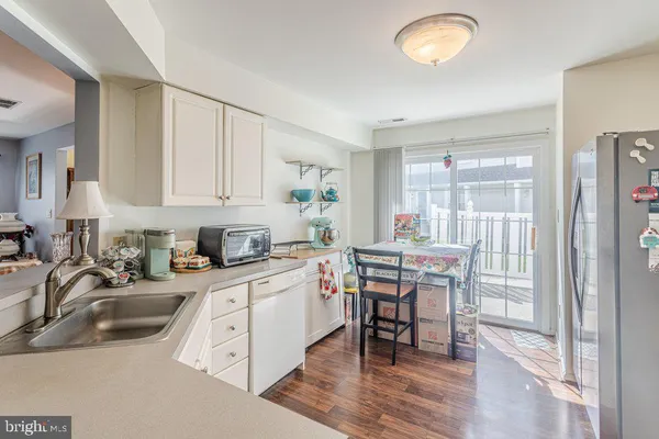 a kitchen with a sink cabinets and window