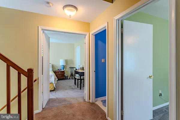 a view of a hallway with couch and furniture