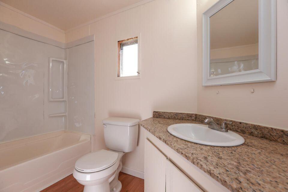 16947 Spring Creek Road Redding, CA 96003 - Photo 11 of 22 a bathroom with a granite countertop sink toilet and a bathtub