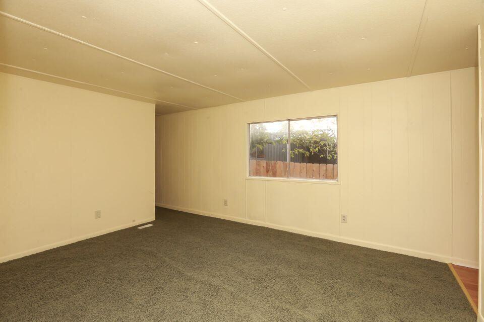 16947 Spring Creek Road Redding, CA 96003 - Photo 14 of 22 an empty room with a empty space and a window