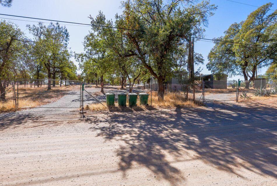 16947 Spring Creek Road Redding, CA 96003 - Photo 17 of 22 a backyard of a house with lots of green space