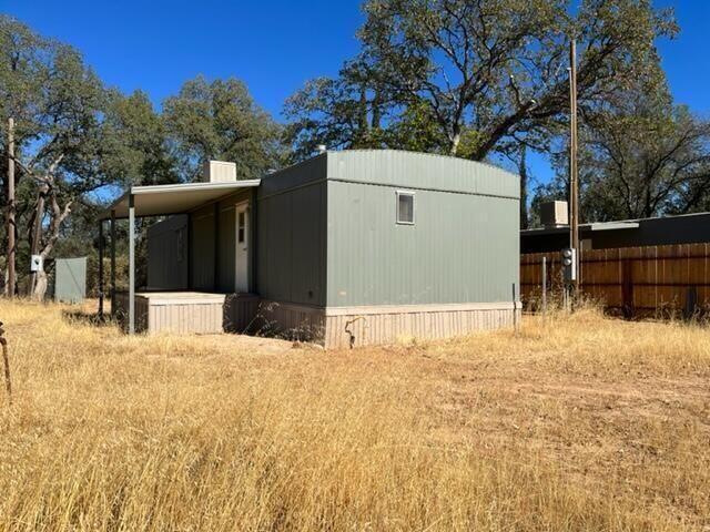16947 Spring Creek Road Redding, CA 96003 - Photo 18 of 22 a view of a backyard of the house