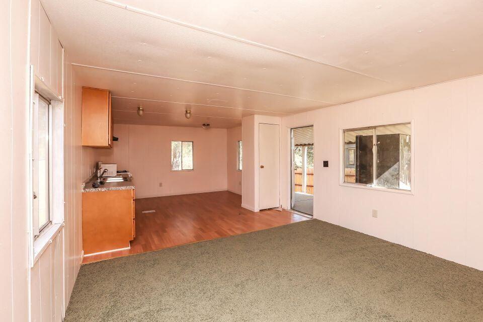 16947 Spring Creek Road Redding, CA 96003 - Photo 8 of 22 a view of a big room with windows and cabinet