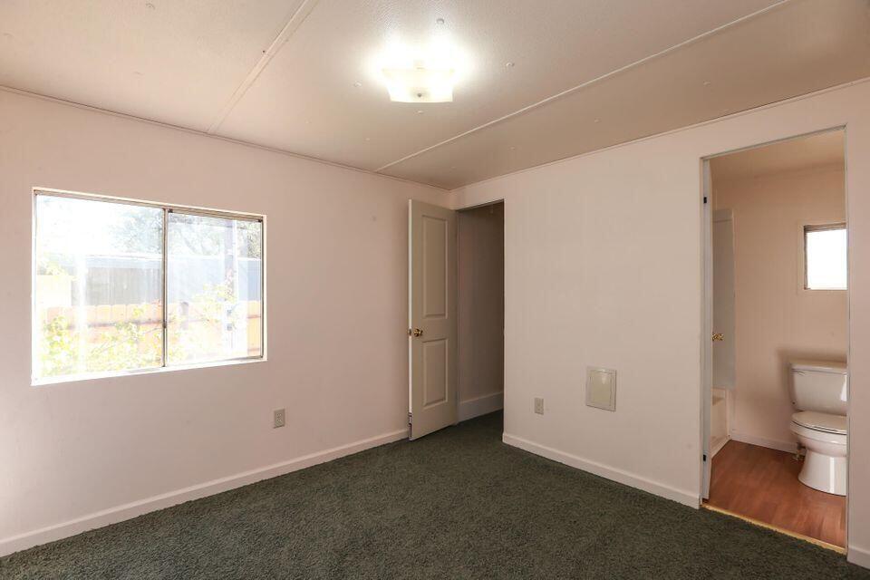 16947 Spring Creek Road Redding, CA 96003 - Photo 9 of 22 an empty room with a window
