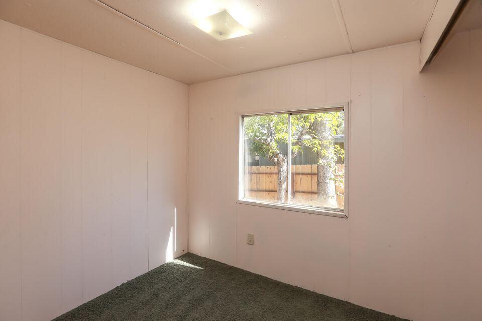 16947 Spring Creek Road Redding, CA 96003 - Photo 10 of 22 an empty room with a window
