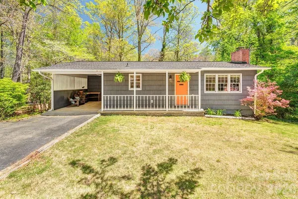 front view of a house with a yard