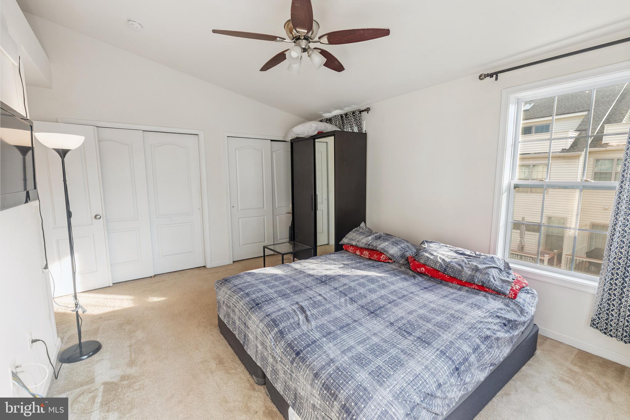 22551 Cambridgeport Square Ashburn, VA 20148 - Photo 21 of 49 a bedroom with a bed and a window