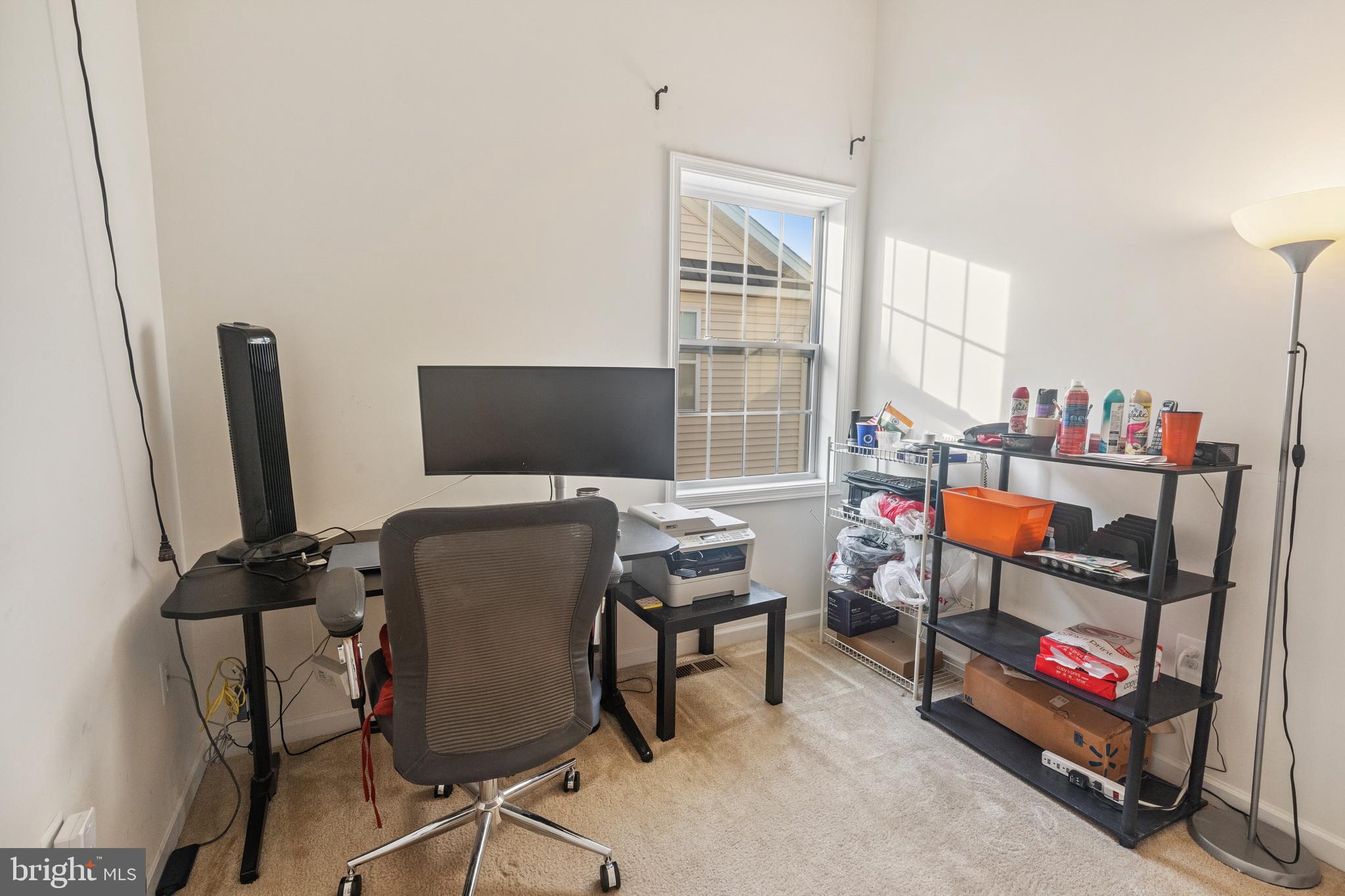 22551 Cambridgeport Square Ashburn, VA 20148 - Photo 24 of 49 a room with furniture and a flat screen tv