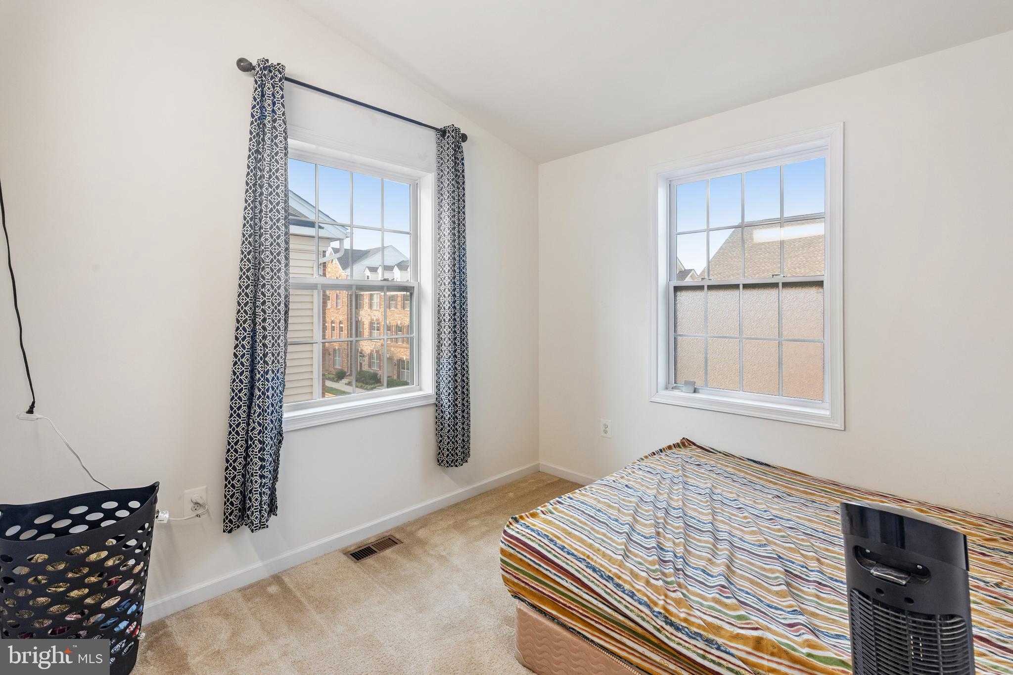 22551 Cambridgeport Square Ashburn, VA 20148 - Photo 26 of 49 a bedroom with a bed and a window