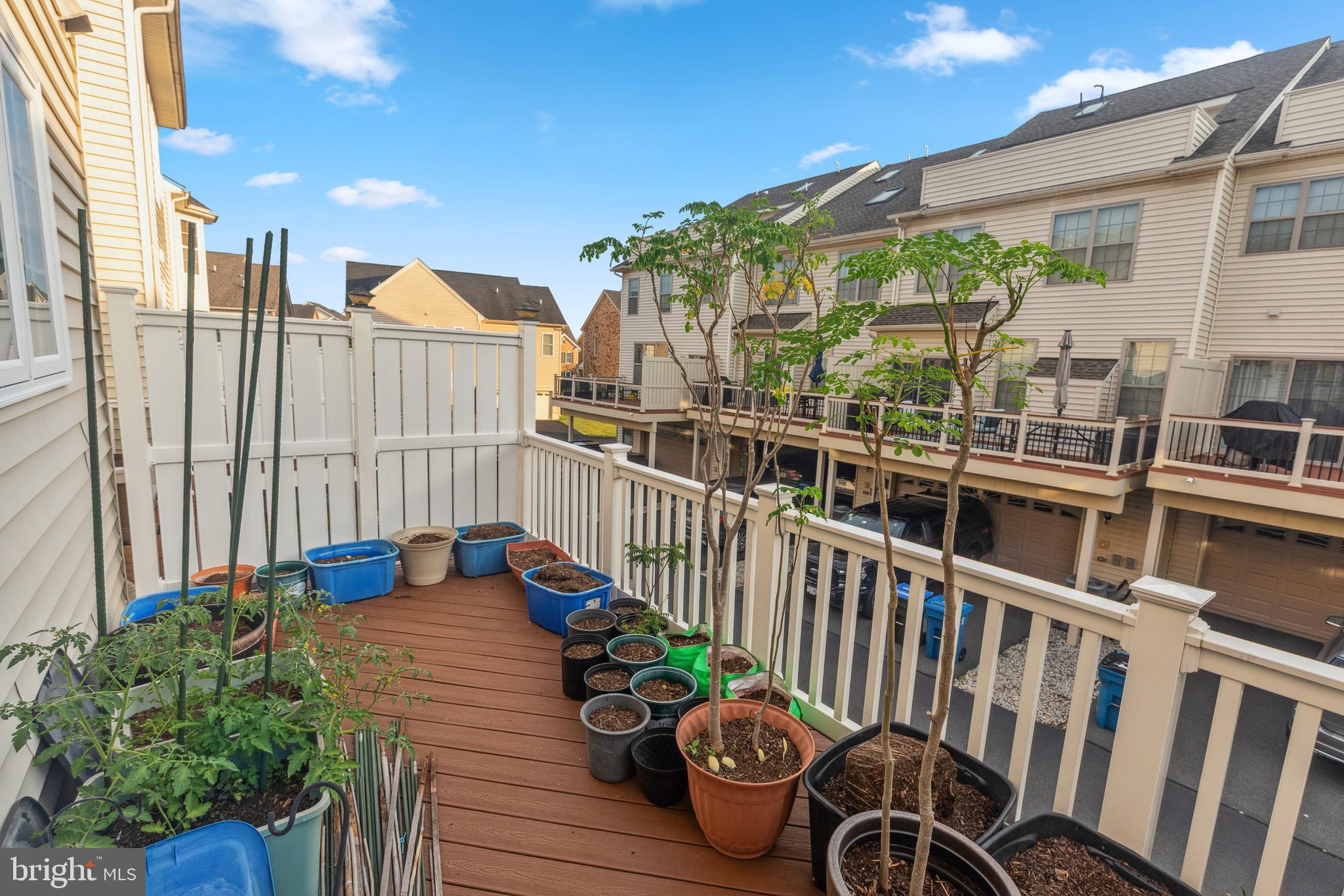 22551 Cambridgeport Square Ashburn, VA 20148 - Photo 30 of 49 a view of a chairs and table on the deck
