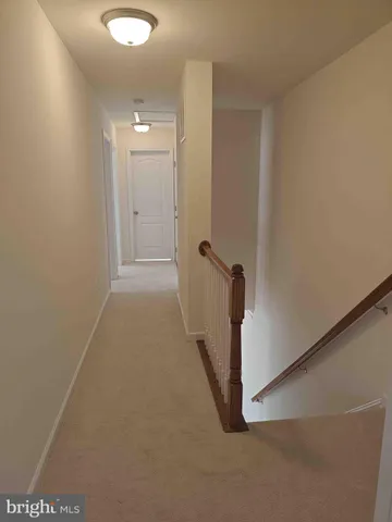a view of a hallway with closet