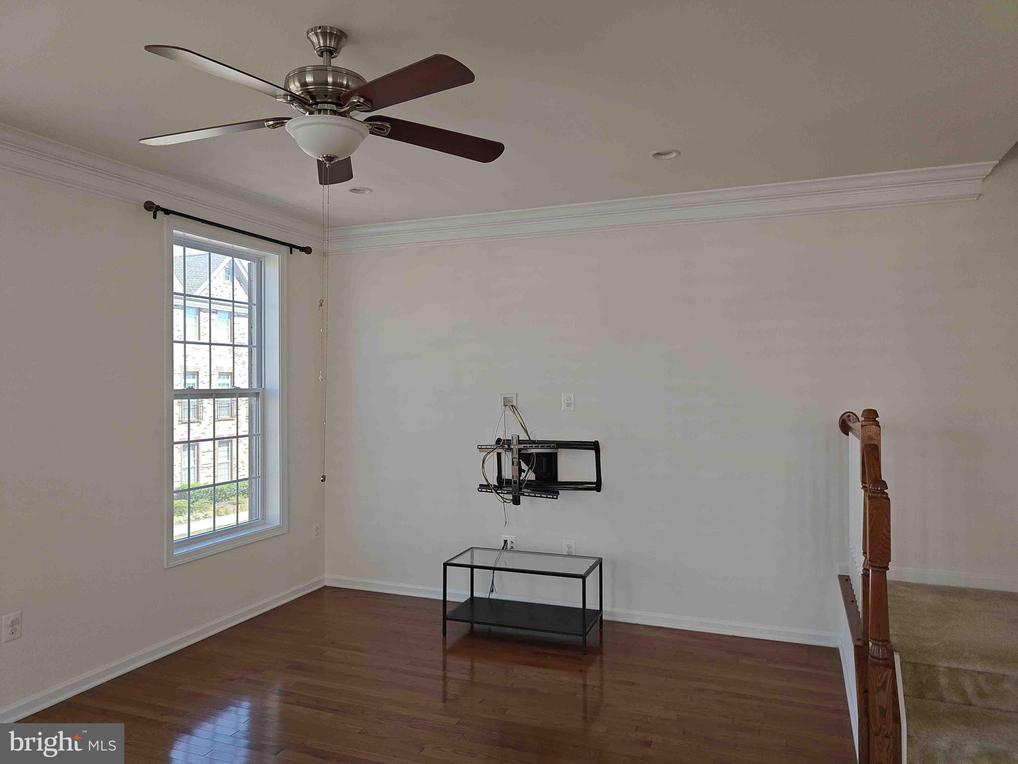 22551 Cambridgeport Square Ashburn, VA 20148 - Photo 41 of 49 a view of a livingroom with a window and wooden floor