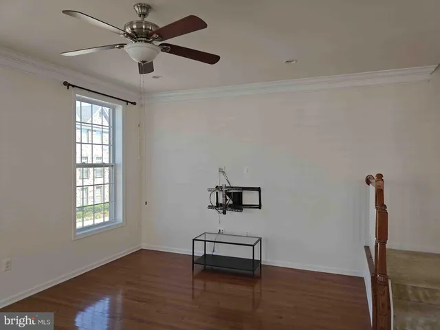 a bedroom with furniture window and wooden floor