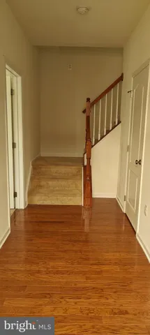 a view of entryway with wooden floor
