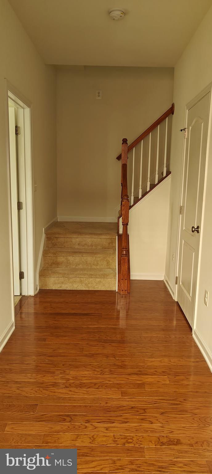22551 Cambridgeport Square Ashburn, VA 20148 - Photo 47 of 49 a view of entryway with wooden floor