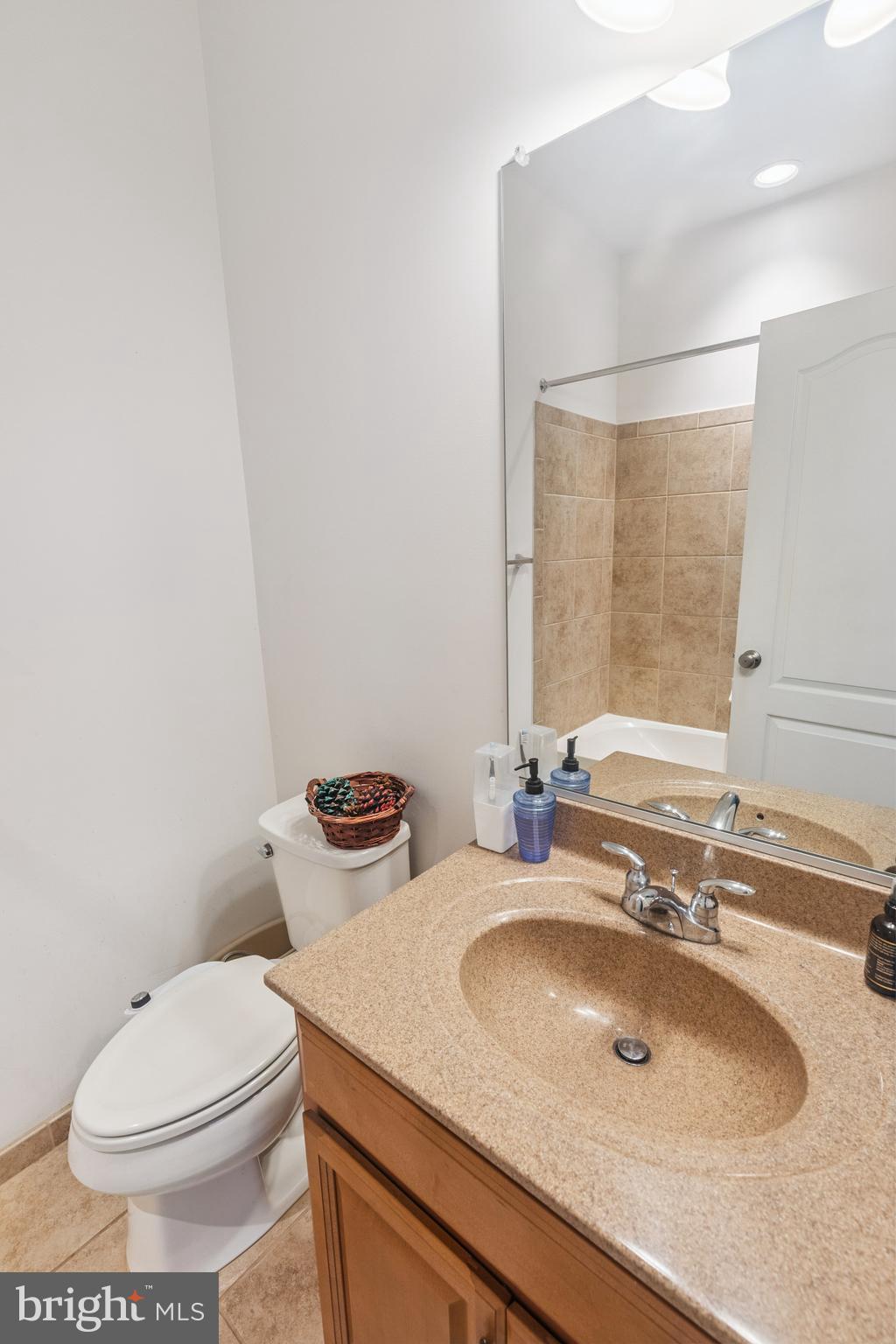 22551 Cambridgeport Square Ashburn, VA 20148 - Photo 10 of 49 a bathroom with a sink and a toilet