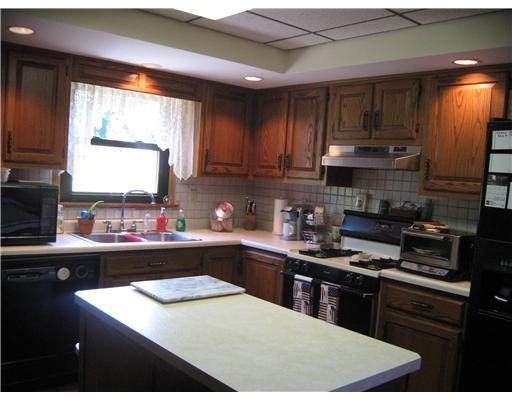 326 Hawthorne Road Pittsburgh, PA 15209 - Photo 4 of 18 Kitchen. custom made solid wood cabinets, new refrigerator 2010, large center island with ample storage, walk out to yard & covered back porch.